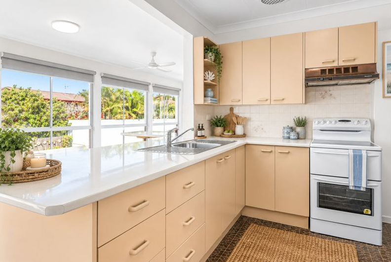 Original kitchen with laminate cabinetry and garden outlook