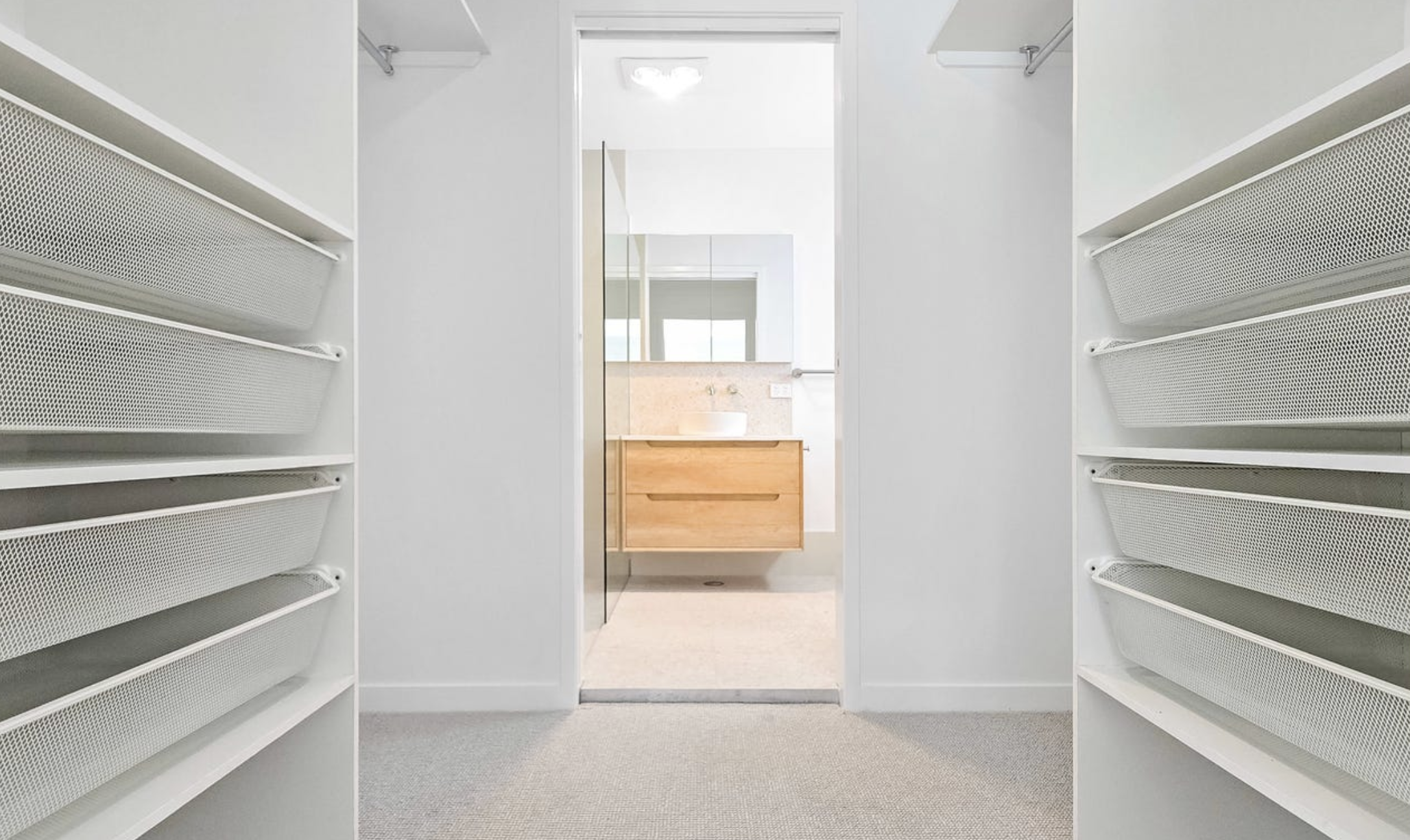 Walk-in robe leading through to the master ensuite